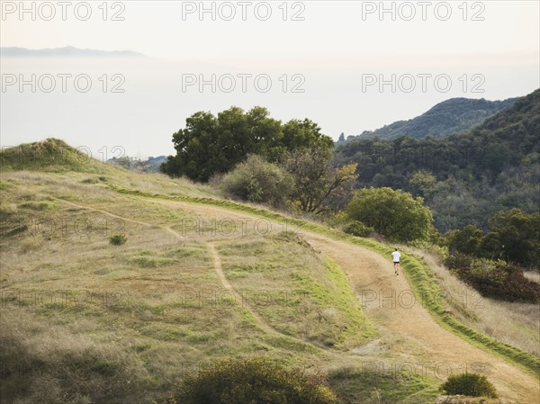 Person running on trail.