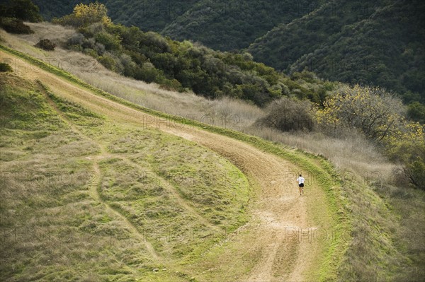 Person running on trail.