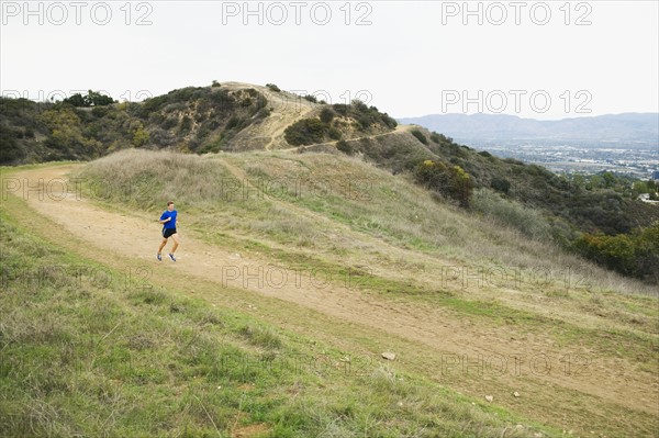 Person running on trail.