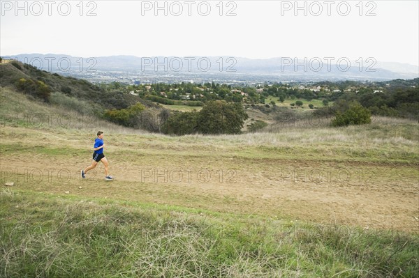 Person running on trail.