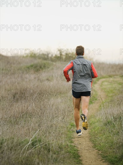 Person running on trail.