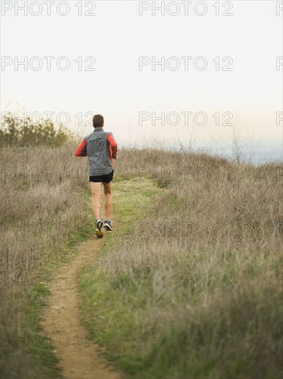 Person running on trail.