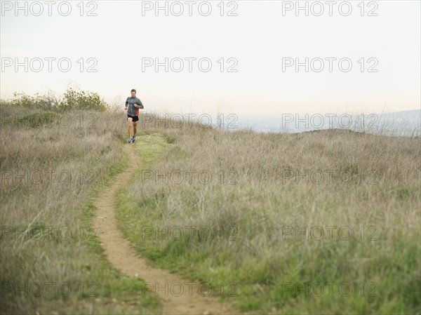 Person running on trail.