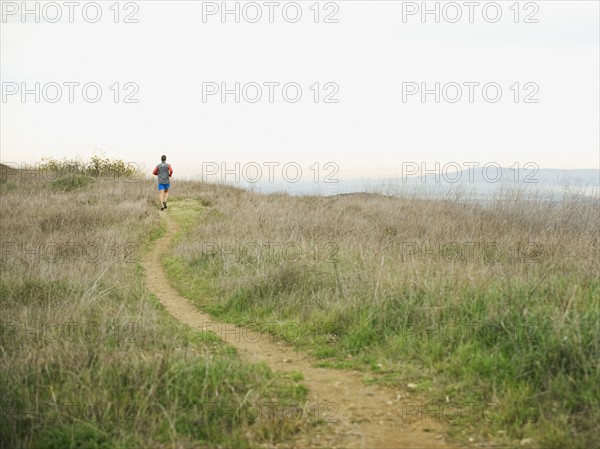 Person running on trail.