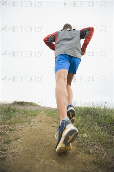 Person running on trail.