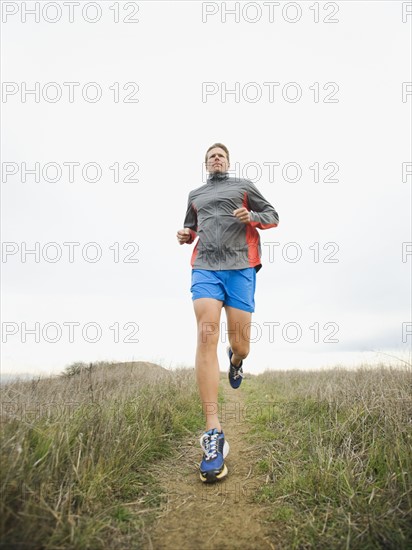 Person running on trail.