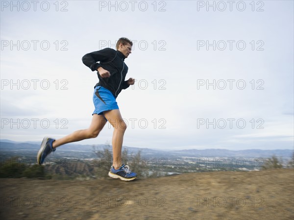 Person running on trail.