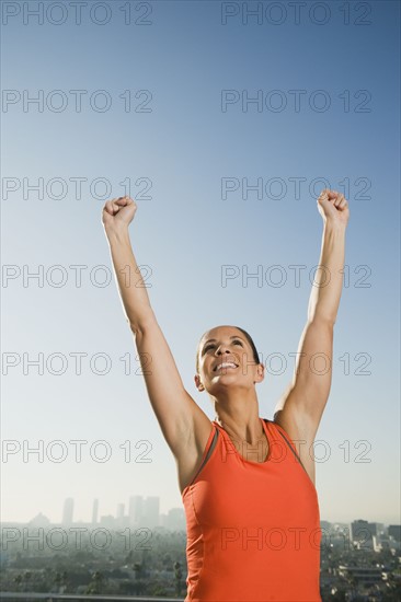 Woman raising her arms.