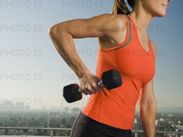 Woman doing weight training.