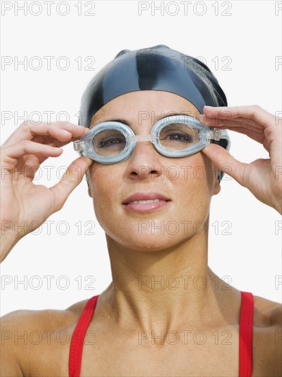 Woman wearing swimming goggles.