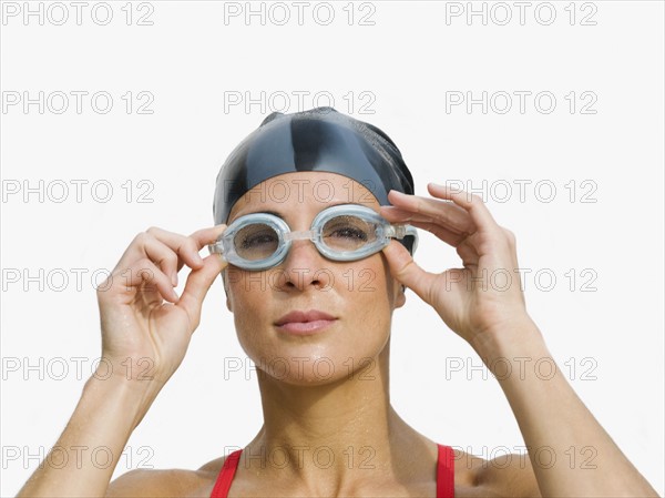 Woman wearing swimming goggles.
