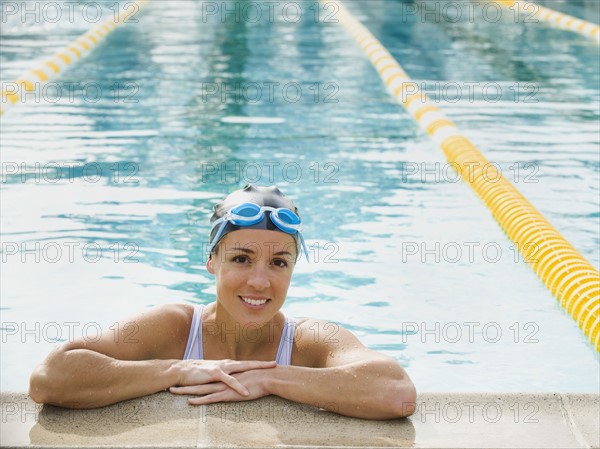 Woman resting after swimming laps.