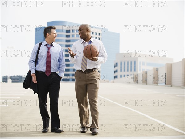 Businessman on their way to basketball game.