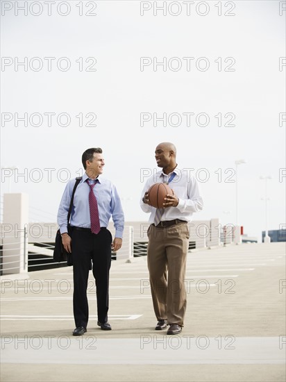 Businessman on their way to basketball game.