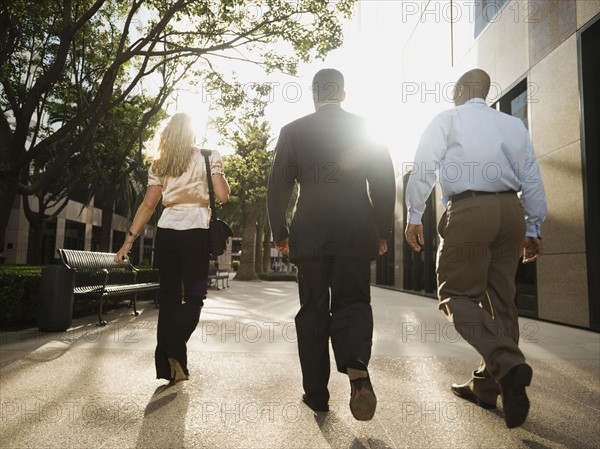 Co-workers walking outside.