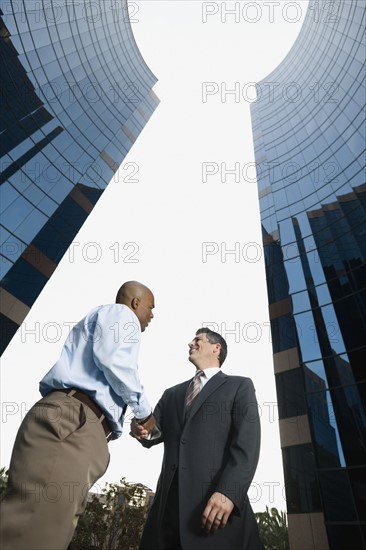 Two businessmen shaking hands.