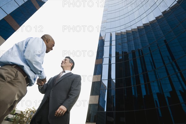 Two businessmen shaking hands.