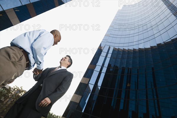 Two businessmen shaking hands.