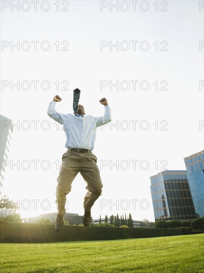 Businessman jumping.