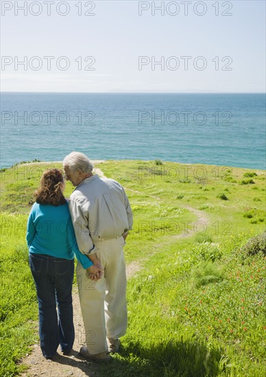 Couple walking to the beach.