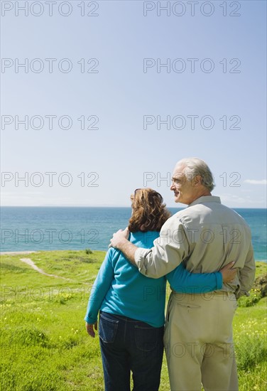 Couple looking at the ocean.