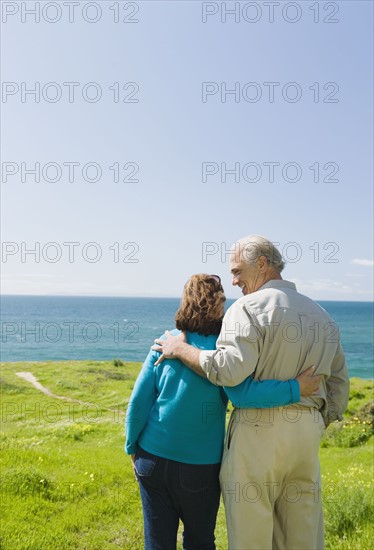 Couple looking at the ocean.