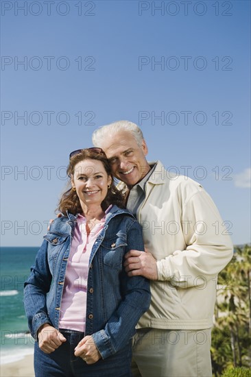 Portrait of a couple by the beach.