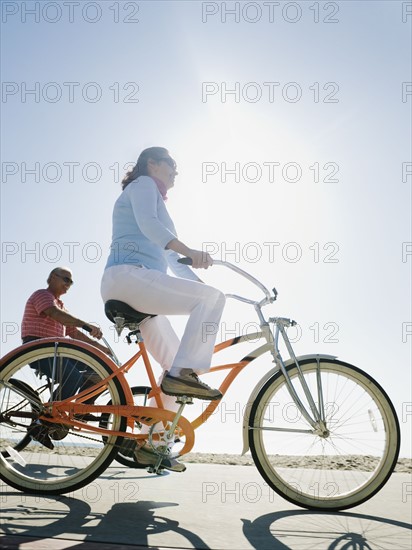 Couple riding bicycles.