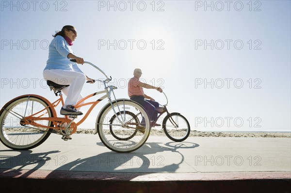 Couple riding bicycles.