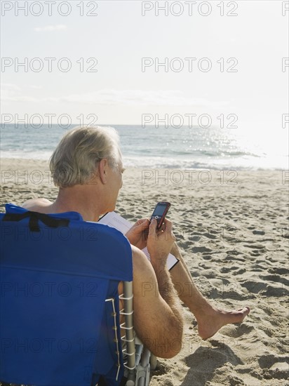 Man relaxing in beach chair.