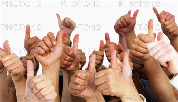 Hands giving thumbs up. Photographe : momentimages