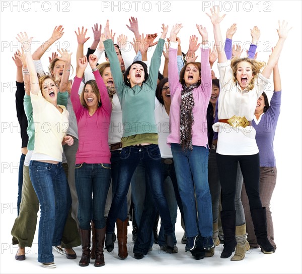 Group of people cheering. Photographe : momentimages