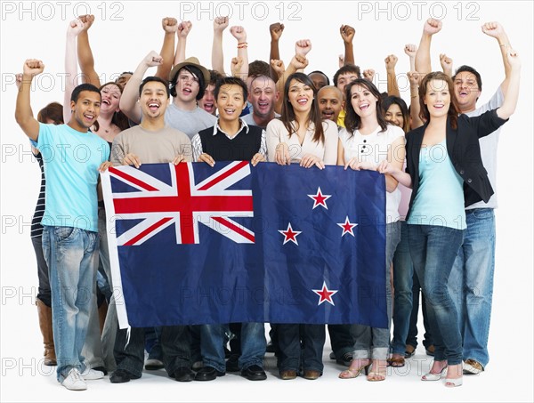 Group of people holding Australian flag. Photographe : momentimages