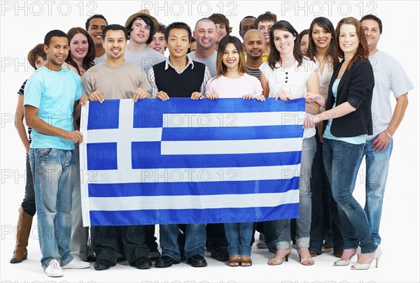 Group of people holding flag. Photographe : momentimages