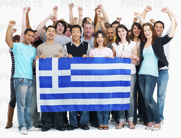 Group of people holding flag. Photographe : momentimages