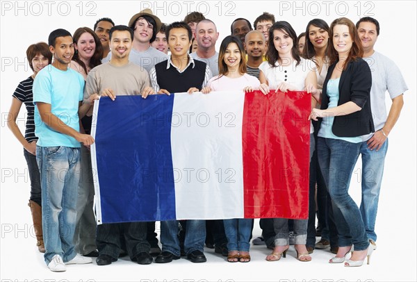 Group of people holding flag. Photographe : momentimages