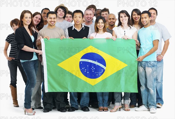 Group of people holding flag. Photographe : momentimages