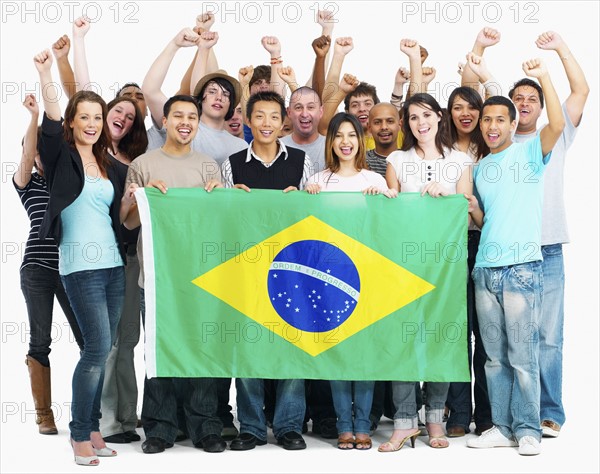 Group of people holding flag. Photographe : momentimages