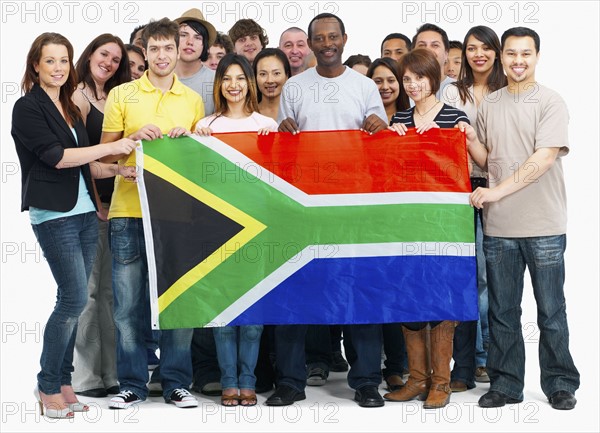 Group of people holding flag. Photographe : momentimages