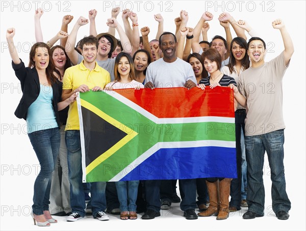 Group of people holding flag. Photographe : momentimages