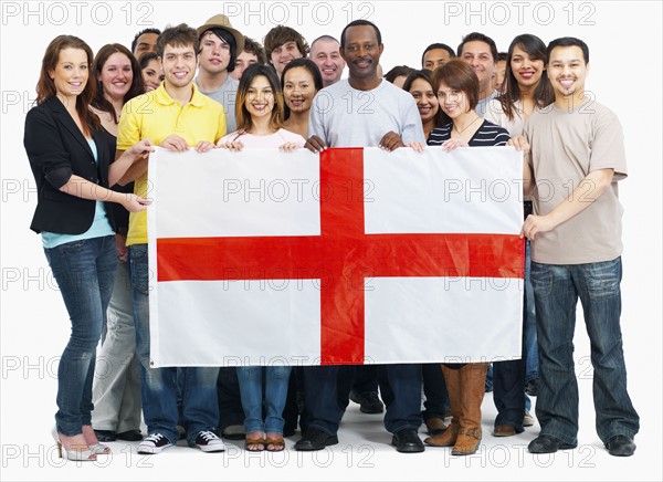 Group of people holding flag. Photographe : momentimages