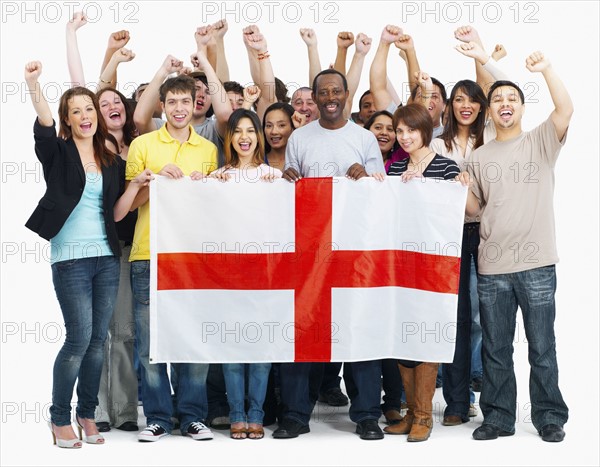 Group of people holding flag. Photographe : momentimages