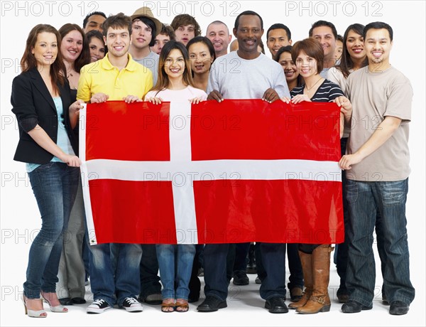 Group of people holding flag. Photographe : momentimages