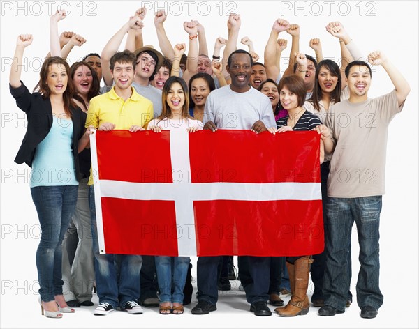 Group of people holding flag. Photographe : momentimages