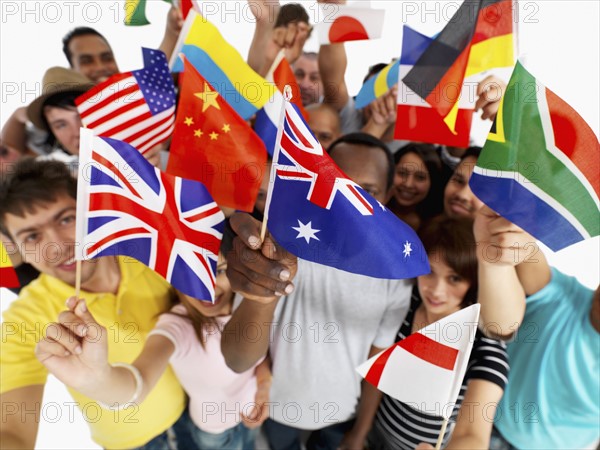 Group of people holding flags. Photographe : momentimages