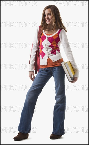 Student carrying books. Photographe : Mike Kemp