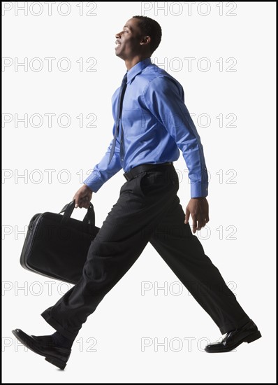 Businessman walking. Photographe : Mike Kemp