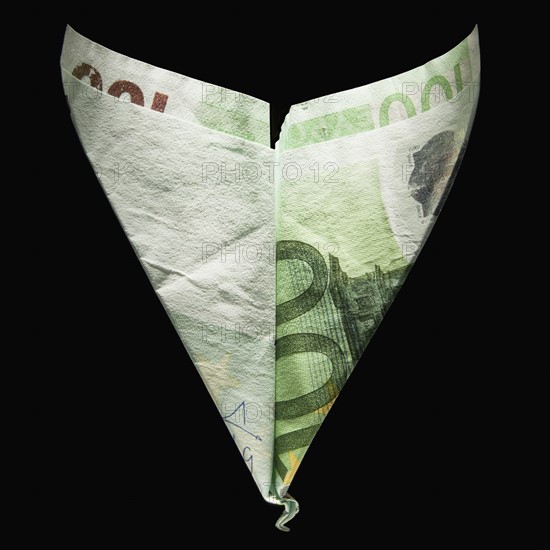 Paper airplane made out of money. Photographe : Mike Kemp