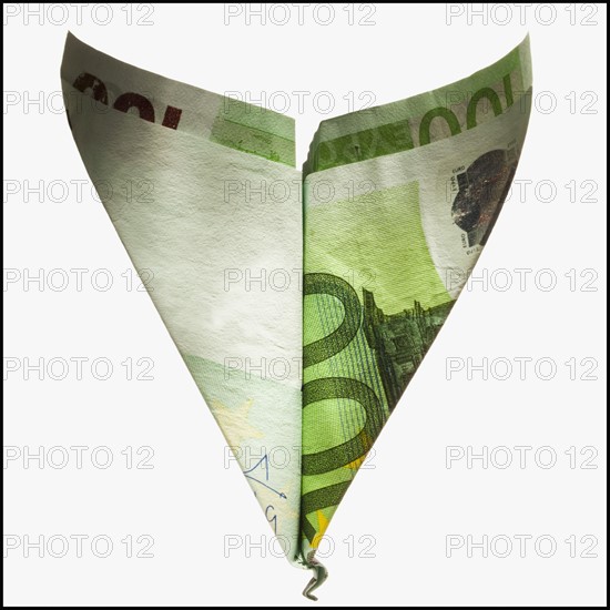 Paper airplane made out of money. Photographe : Mike Kemp