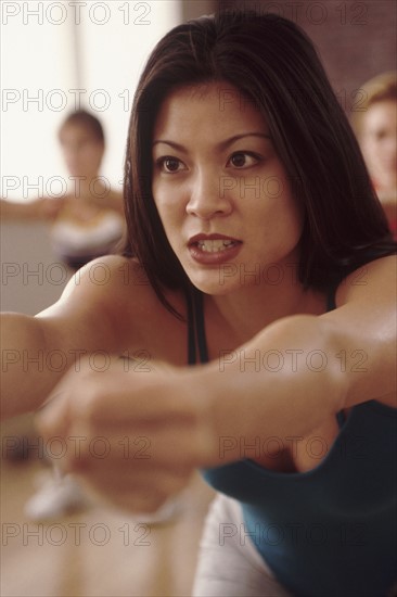 Woman at an exercise class. Photographe : Rob Lewine